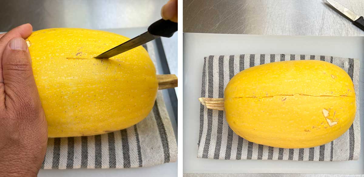 small knife making slits in the hard shell of a raw spaghetti squash, which is sitting on a striped dish towel.