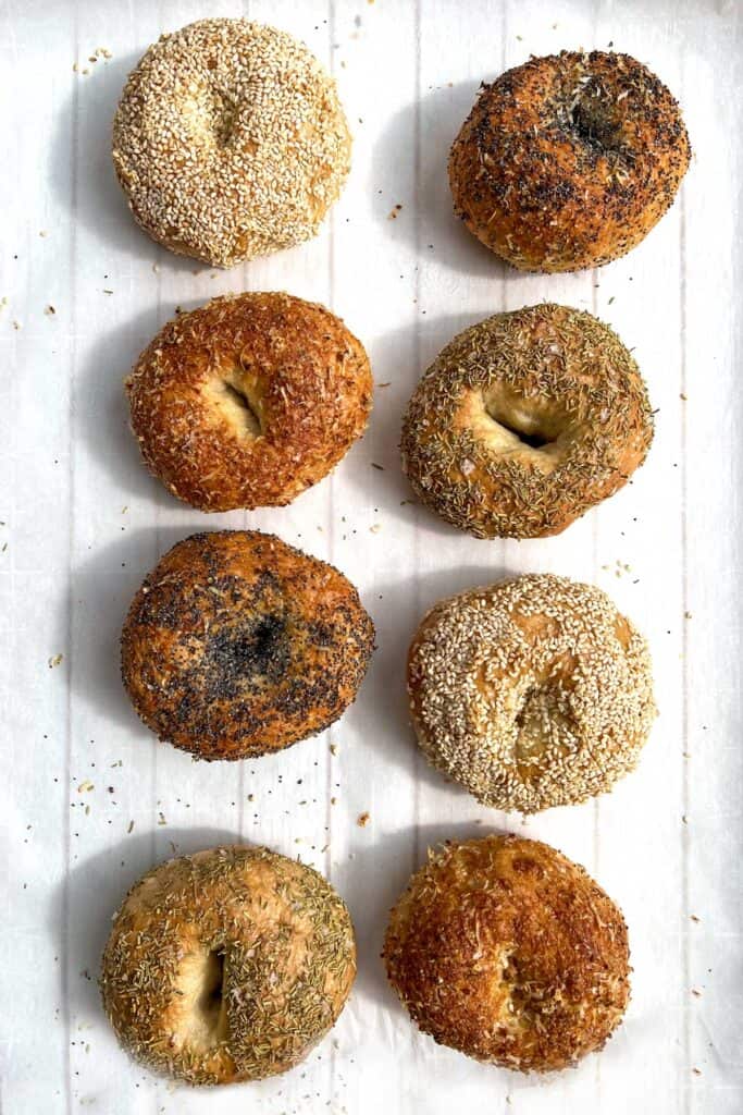 8 assorted bagels on a white tray