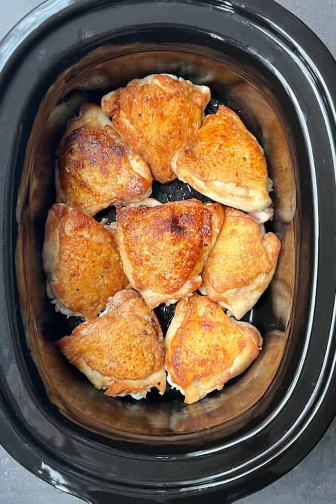 8 seared chicken thighs in a slow cooker