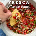 Pinterest pin with a corn tortilla chip being dipped into a bowl filled with finely chopped salsa fresca made from tomatoes, chilies, onion and cilantro, a text overlay says Mexican Salsa Fresca (Pico de Gallo).