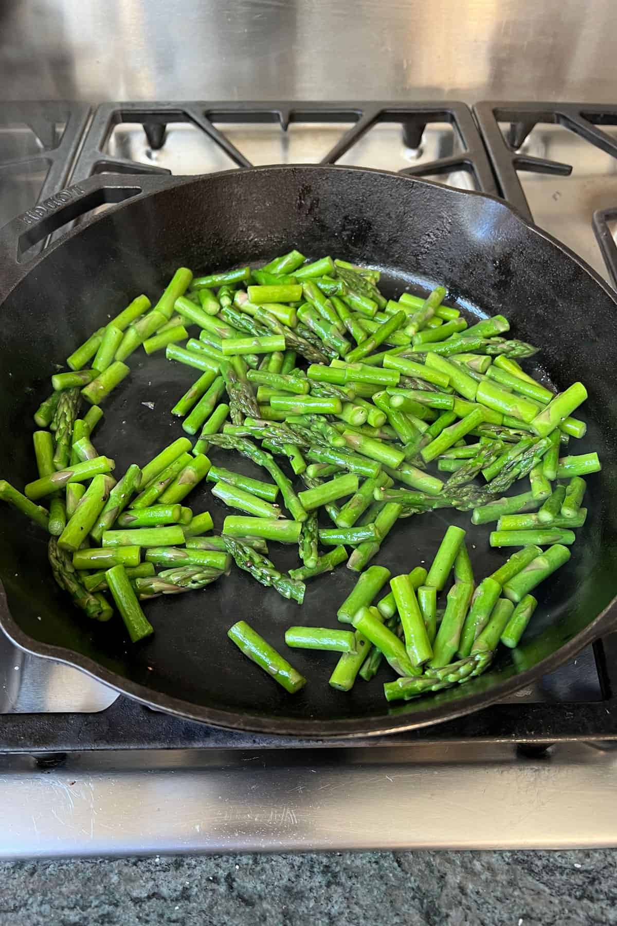 sliced and sautéed zucchini in a cast iron skillet