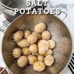 salt crusted potatoes in a colander with a salt crusted pot in the background