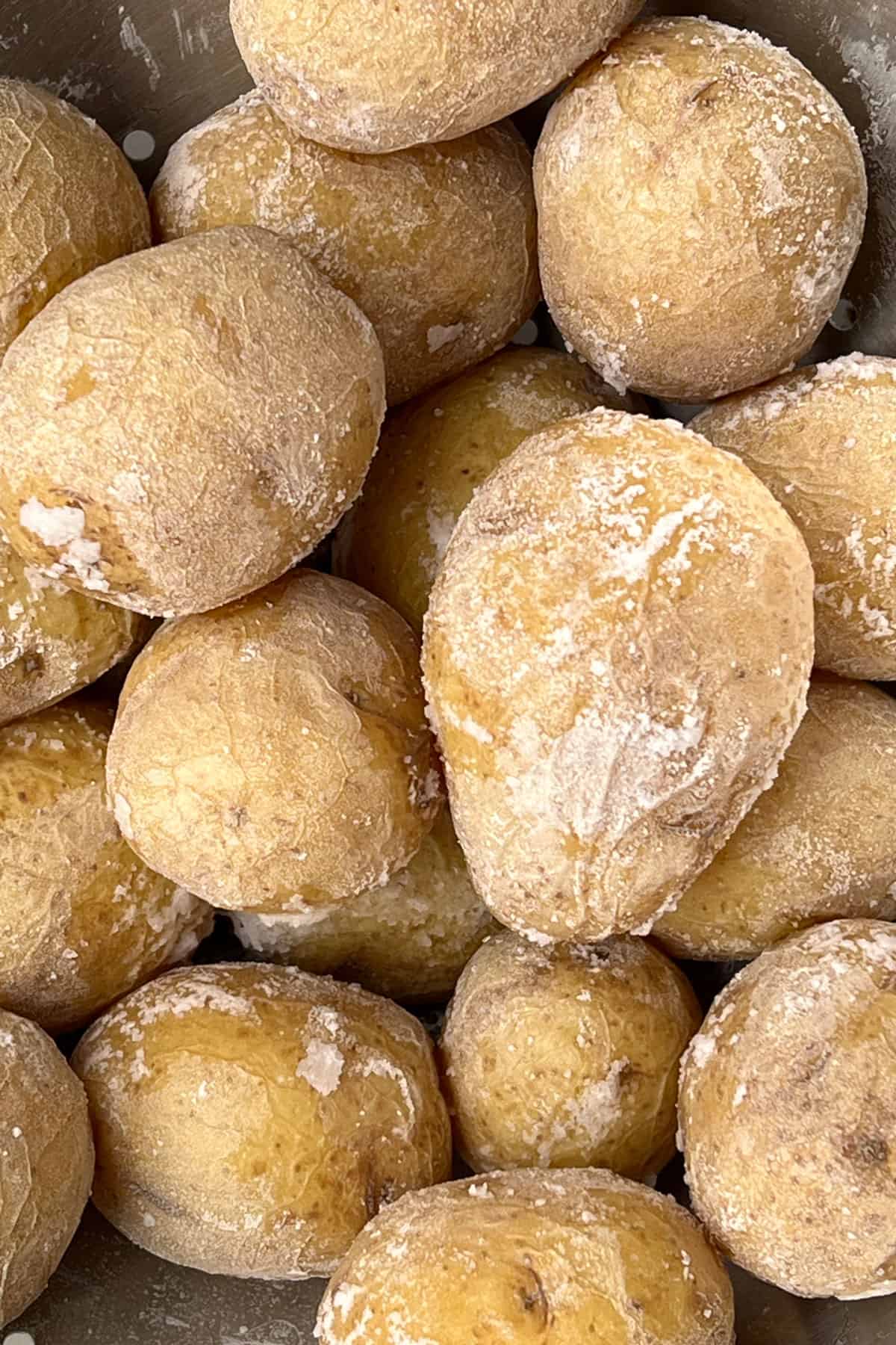 close up of about a dozen salt crusted potatoes