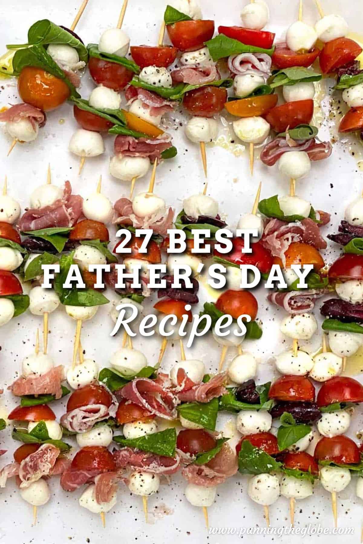 dozens of mini caprese salad skewers on a white platter