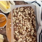 loaf of Irish brown bread with butter and honey on the side