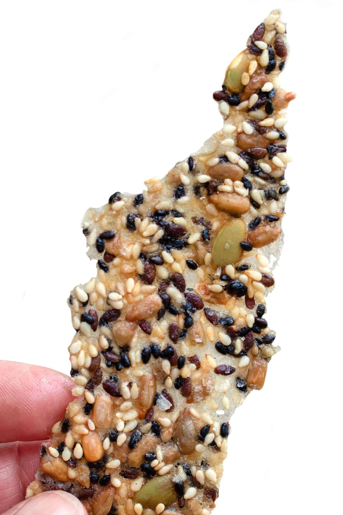 One long, thin, crisp-looking seeded cracker.