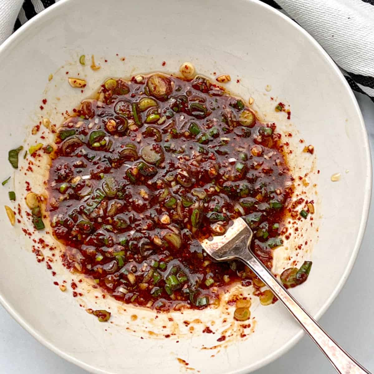 Korean sweet and spicy sauce in a small white bowl