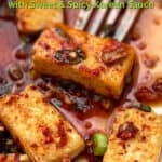 Pinterest pin with pieces of fried tofu drenched in sauce and topped with chopped scallions.