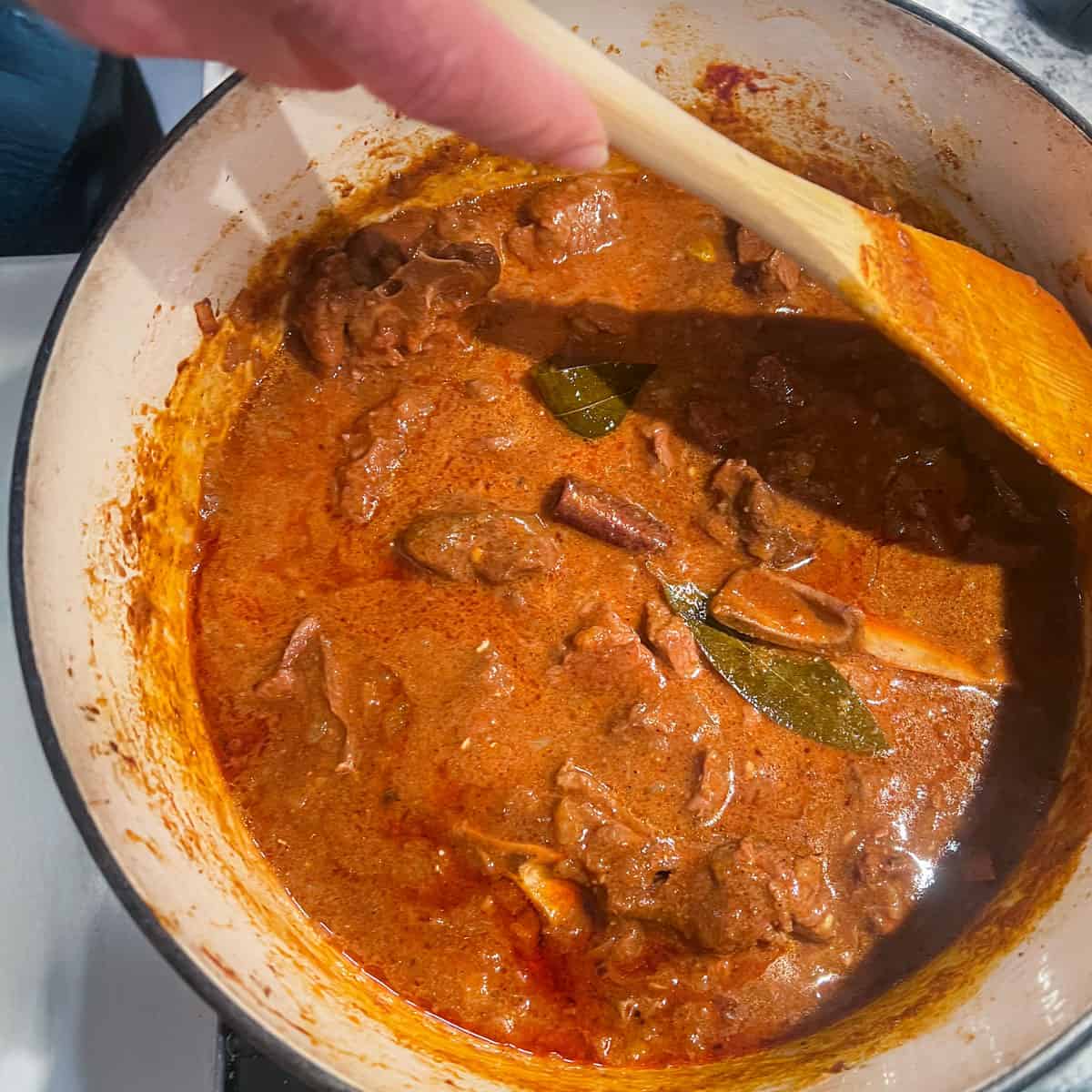 Dutch oven full of lamb rogan josh as it just finishes cooking.