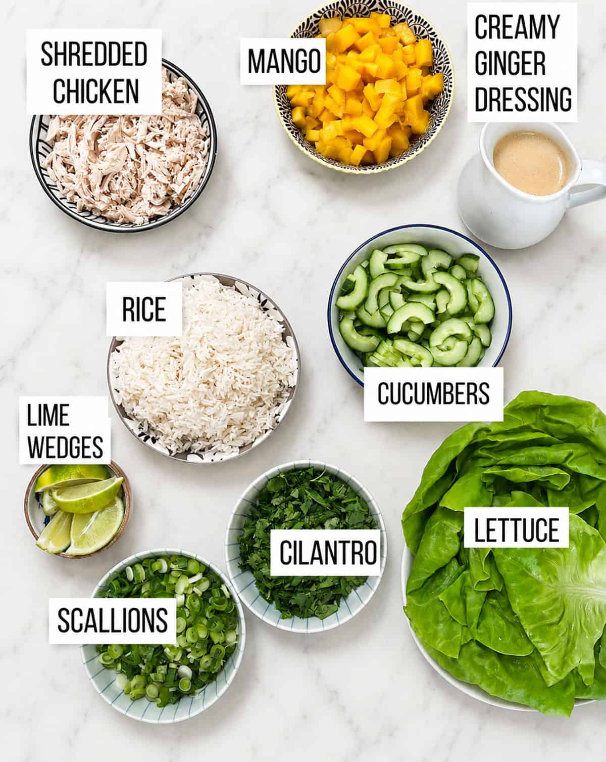 ingredients for chicken mango lettuce wraps, each in a small bowl.
