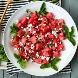 watermelon salad with feta and mint in a serving bowl