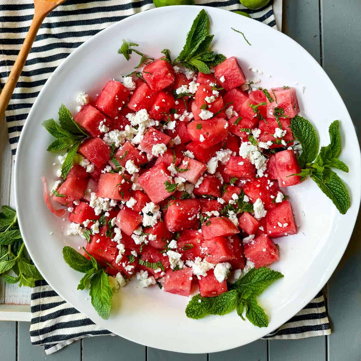 watermelon salad with feta and mint in a serving bowl