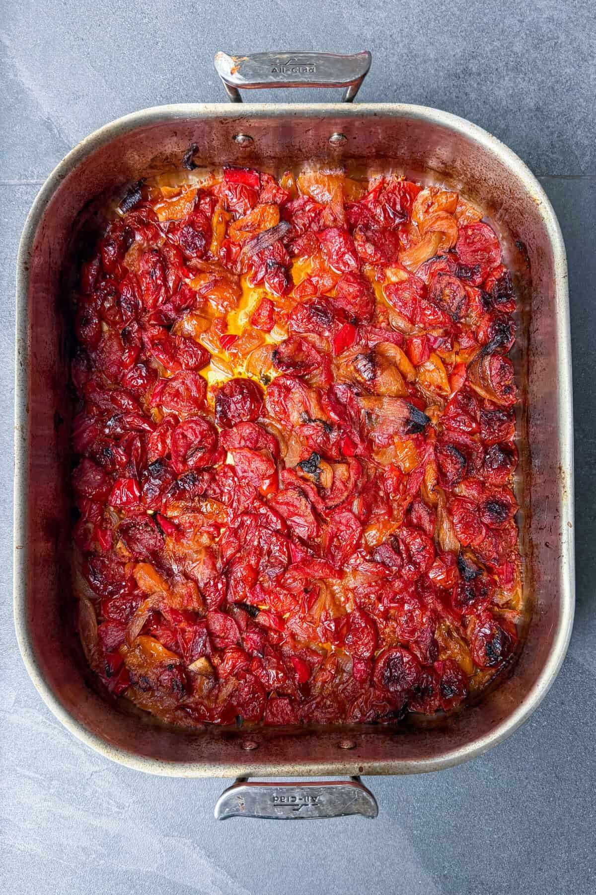 Fresh tomatoes roasted until deeply caramelized in a roasting pan