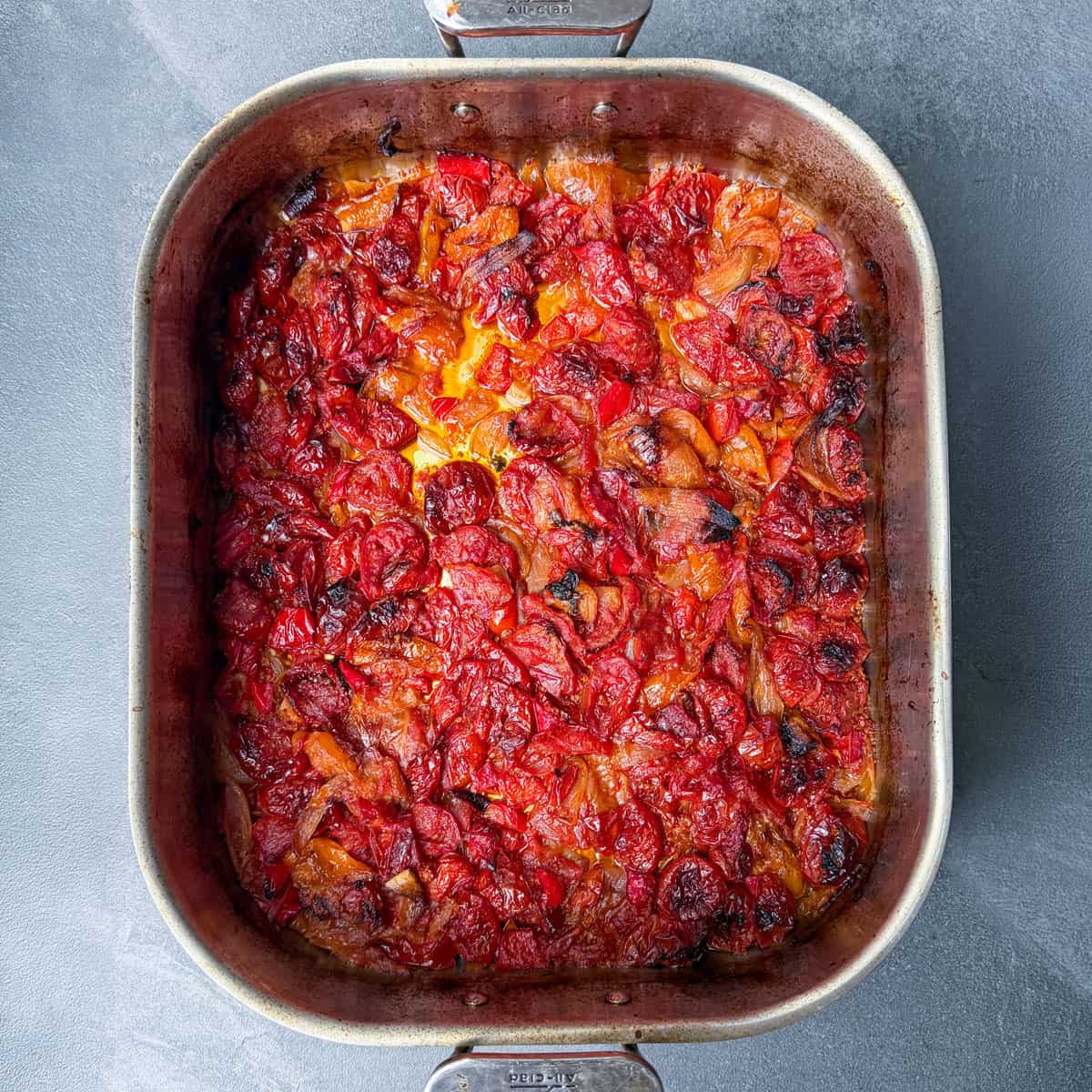 Fresh tomatoes roasted until deeply caramelized in a roasting pan